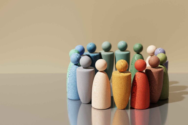 Multicolored wooden abstract figures in a circle.